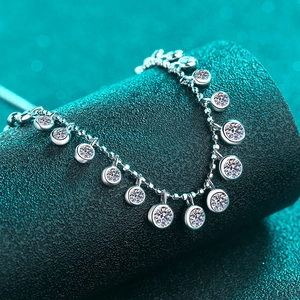 Elegant S925 sterling silver moissanite bracelet featuring multiple round charms