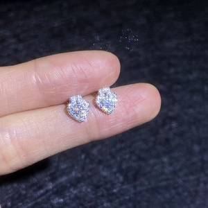 Elegant S925 sterling silver heart-shaped moissanite stud earrings shown on hand