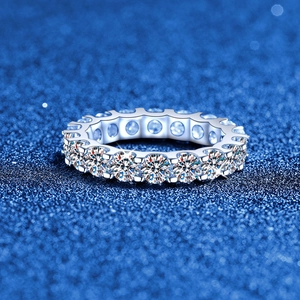 S925 sterling silver eternity band featuring brilliant moissanite stones in a pavé setting