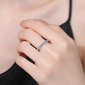 Sparkling S925 sterling silver eternity ring with pavé moissanite stones on finger