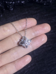 Detailed view of S925 sterling silver four-leaf clover pendant necklace with sparkling gems