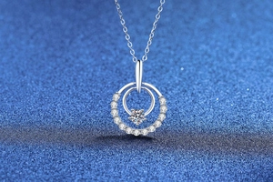 Detail view of 925 sterling silver double ring necklace with moissanite and pave setting