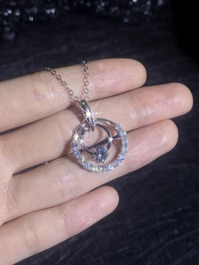 Close-up of double ring moissanite necklace showing starry sparkle effect on 925 silver