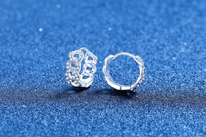 Close-up of S925 silver moissanite hoop earrings with twisted chain and crystal pavé