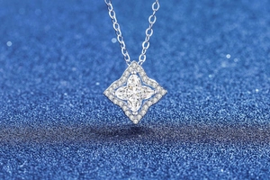 Macro shot of S925 silver clover pendant with central marquise-cut moissanite stone