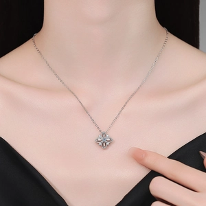 Elegant S925 sterling silver four-leaf clover necklace with moissanite pendant on a model