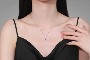 Detail of S925 sterling silver marquise necklace showing the pendant on a female model
