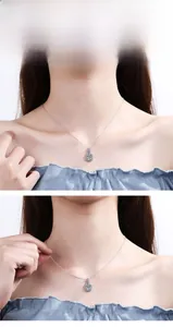 Close-up of s925 silver moissanite necklace with square halo pendant on female model