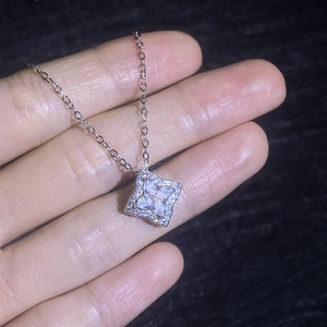 Sparkling S925 sterling silver clover necklace with heart-shaped moissanite petals