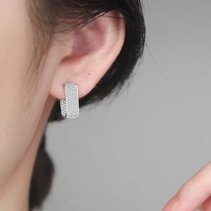 Sparkling S925 sterling silver U-shaped hoop earrings with pave moissanite on model