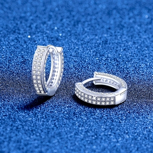 Elegant S925 sterling silver huggie earrings with full pave moissanite on blue texture