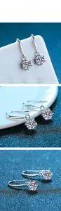 Dettagli macro di orecchini pendenti in argento con moissanite a sei griffe brillanti
