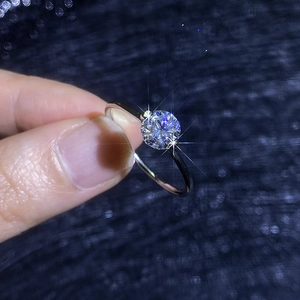 Classic 925 sterling silver 1 carat moissanite solitaire ring held by hand