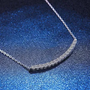 Elegant S925 sterling silver smile necklace with curved moissanite bar on dark background
