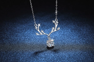 Detailed view of S925 silver reindeer antler pendant with a brilliant moissanite stone