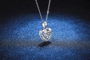 Macro detail of S925 sterling silver heart pendant with sparkling moissanite gemstone