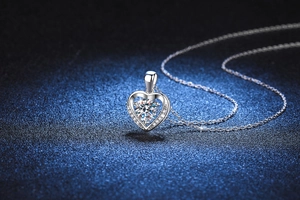 Macro shot of S925 sterling silver heart pendant with moissanite center stone and chain