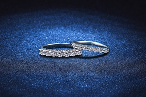 Detail of two 925 sterling silver eternity rings with sparkling moissanite stones