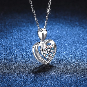 S925 sterling silver heart necklace with a large round moissanite pendant on a blue base