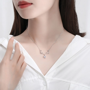 Elegant S925 sterling silver reindeer horn necklace with a sparkling round moissanite pendant