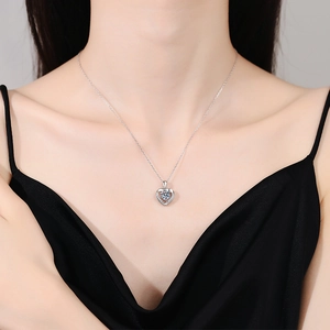 Elegant S925 silver heart necklace with sparkling round moissanite on a female model