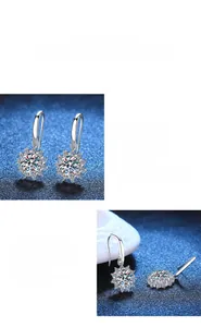 Dettaglio macro di orecchini moissanite a forma di fiocco di neve in argento S925 lucido