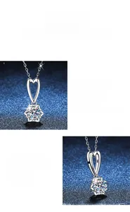 Close-up of S925 silver heart necklace with brilliant 1 carat moissanite gemstone