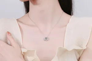 Close-up of S925 silver hexagram pendant with dancing moissanite on female model
