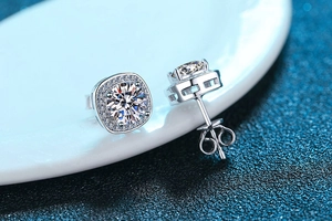 Detail of s925 silver stud earrings featuring princess cut moissanite and halo setting