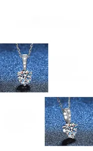 Macro detail of three-prong set moissanite pendant with polished S925 silver chain