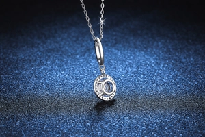 Macro detail of S925 sterling silver necklace with classic 1 carat moissanite halo pendant