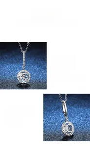 Detail of round cut moissanite pendant featuring s925 silver chain and halo setting
