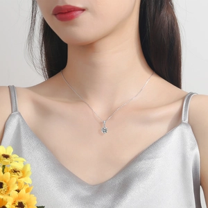 S925 sterling silver necklace with a 1-carat moissanite pendant worn by a model