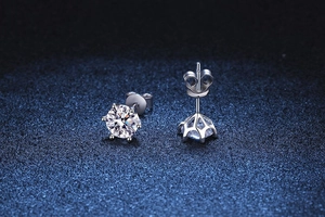 Detailed view of six-prong moissanite earrings in s925 silver with crown setting