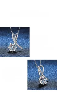 Détail macro du pendentif nœud en argent s925 montrant l'éclat du moissanite pur