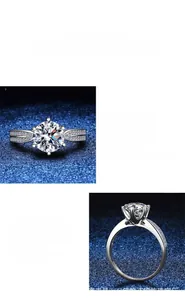 Detailed macro view of the 6-prong moissanite setting and sparkling silver band texture