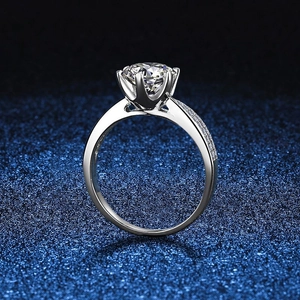 Classic S925 sterling silver six-prong moissanite ring with side accent diamonds on blue background
