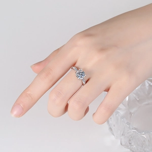Classic S925 sterling silver six-prong moissanite engagement ring on model's hand