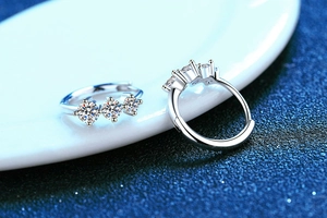 Macro shot of 925 sterling silver adjustable rings featuring three brilliant moissanite stones