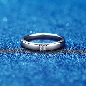 Luxurious S925 sterling silver ring with princess cut moissanite on blue background
