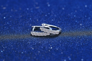 Detail view of s925 silver hoop earrings with seven round-cut Moissanite stones