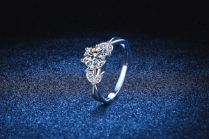 Macro shot of 1 carat moissanite ring with six-prong setting and twisted silver band