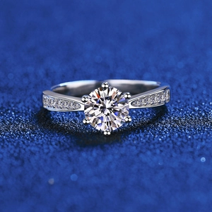 Classic 925 sterling silver six-prong moissanite ring with side diamonds on blue background