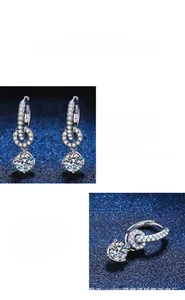 Close-up of S925 sterling silver earrings featuring 0.5ct moissanite stones and small pavé hoops