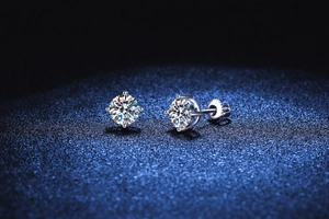 Macro shot of 4-prong S925 silver moissanite stud earrings with secure screw-back closures