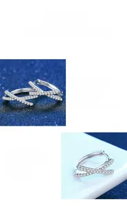Macro shot of S925 silver bow stud earrings with sparkling moissanite pavé stones