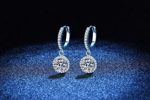 Close-up of S925 silver hoop earrings with brilliant round Moissanite halo settings