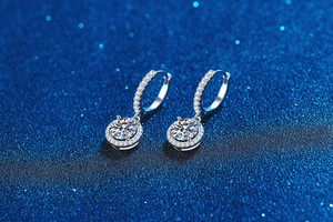 Macro shot of S925 silver moissanite hoop earrings with halo setting on starry background