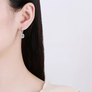 S925 sterling silver drop earrings with brilliant cut moissanite on female model