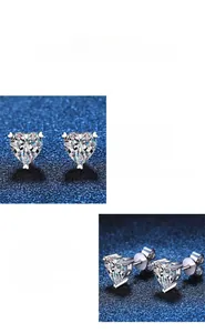 Macro shot of heart-cut moissanite earrings in s925 silver with detailed three-prong setting